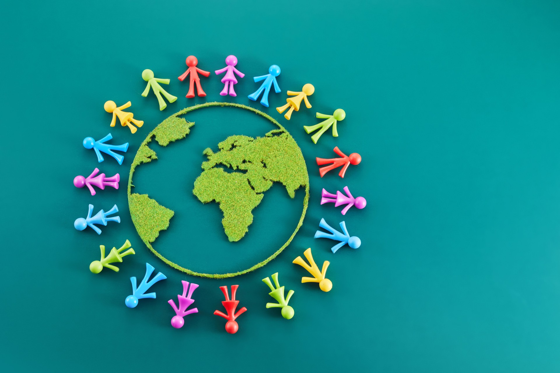 People from all around world standing on globe,